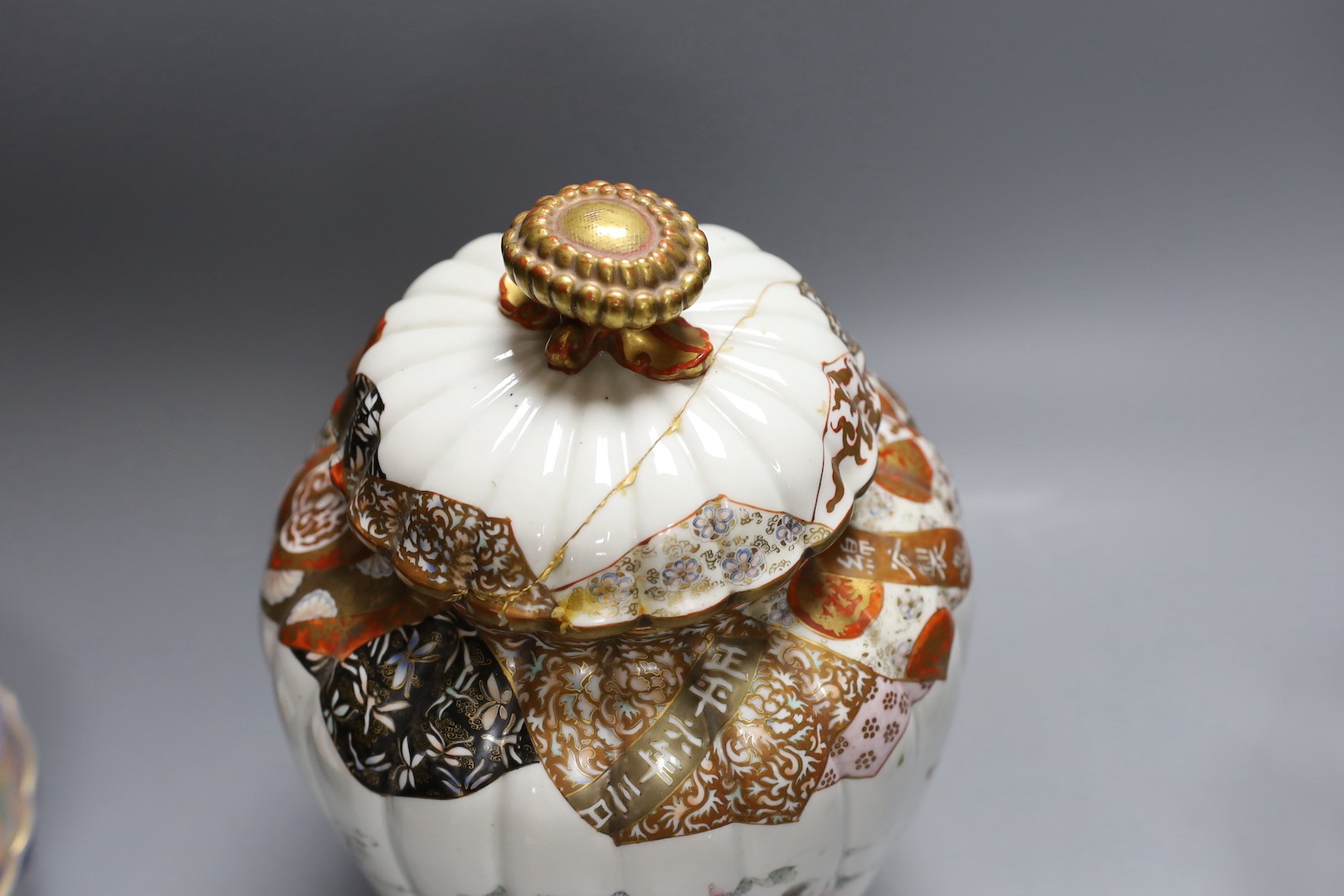 A Japanese kutani bottle vase, similar vase and cover (a.f), an Imari bowl and blue and white bowl. Largest 27cm